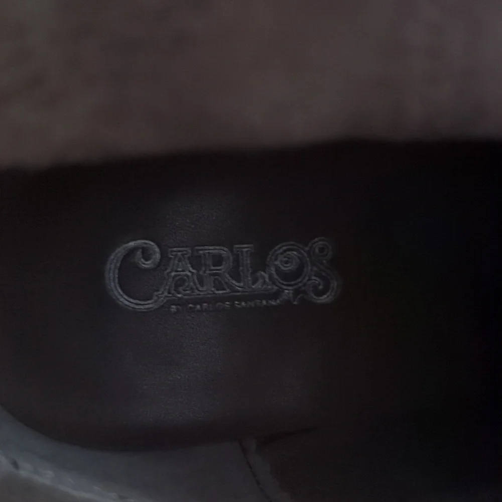Ankle booties by Carlos Santana